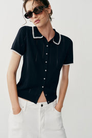 Veste polo en maille à dentelle et manches courtes